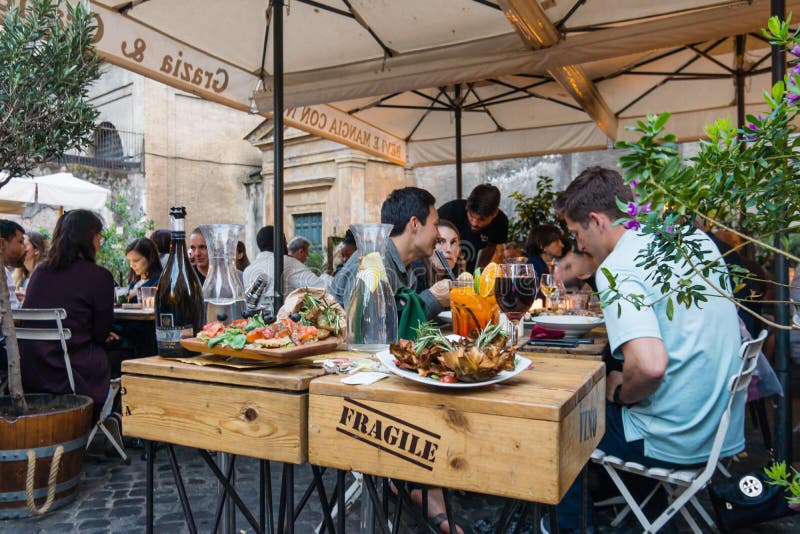 Having Dinner at an Outdoor Italian Restaurant Editorial Stock Image