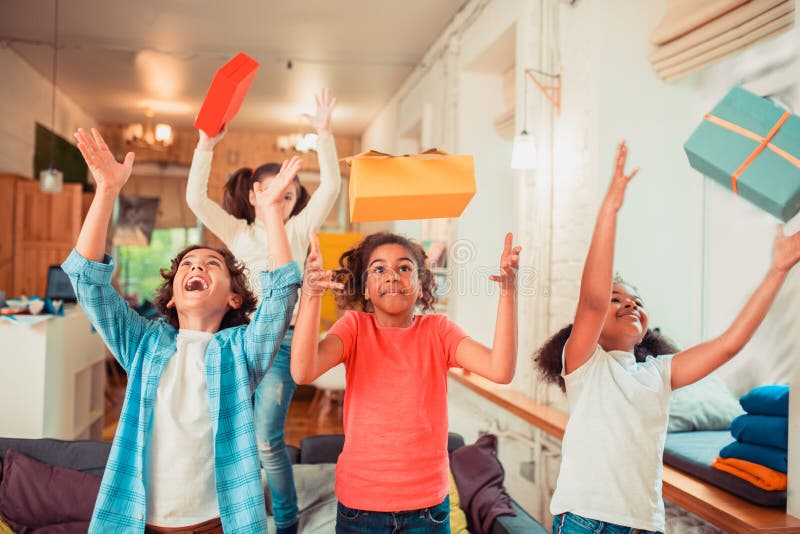 Joyful and Active Kids Throwing Gift Boxes Stock Image Image of