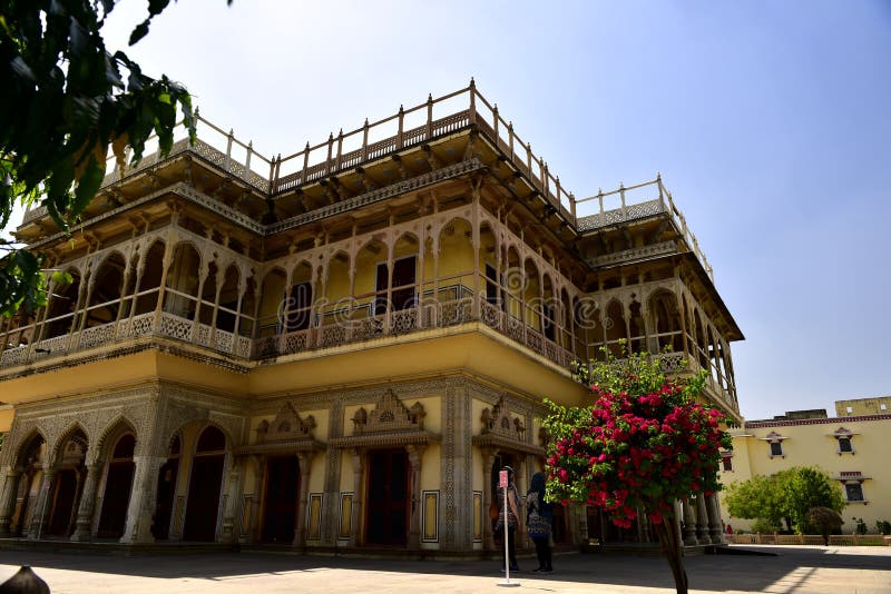 The palace of Jaipur, erected in 1799 on the initiative of the Sawai Pratapa Singh maharaja, is a perfect example of Rajputs architecture. A red sandstone monument with a monumental façade stood at one of the main streets of Jaipur to allow the court lady to observe the everyday life of the city. In the form of a crown of Krishna, a Hindu god. Its appearance resembles a honeycomb. It is located in the heart of the business center of Jaipur. Historical places of sight seeing family friends. The palace of Jaipur, erected in 1799 on the initiative of the Sawai Pratapa Singh maharaja, is a perfect example of Rajputs architecture. A red sandstone monument with a monumental façade stood at one of the main streets of Jaipur to allow the court lady to observe the everyday life of the city. In the form of a crown of Krishna, a Hindu god. Its appearance resembles a honeycomb. It is located in the heart of the business center of Jaipur. Historical places of sight seeing family friends