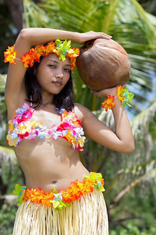 Female Hawaiian Hula dancer wearing coconut bikini, yellow lei