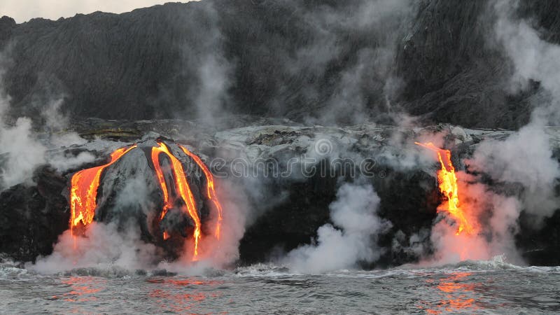 Hawaii Lava flowing into the ocean from lava volcanic eruption on Big Island Hawaii, USA. Lava stream flowing in Pacific