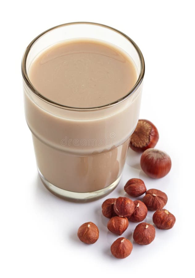 Hazelnut Milk on Blue Table Background. Non Dairy Alternative Vegan