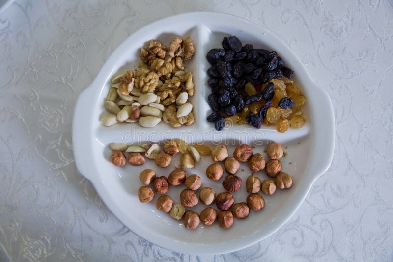 Hazelnuts, walnuts, black cheese, white raisins, nuts royalty free stock image