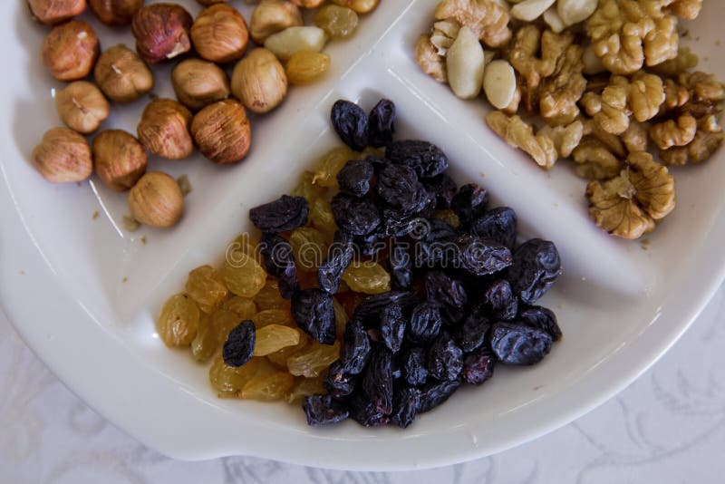 Hazelnuts, walnuts, black cheese, white raisins, nuts royalty free stock image