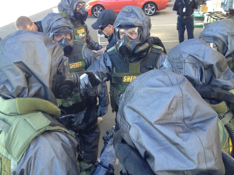 Sheriffs deputies assemble their Level3 HAZMAT suits and gas mask to prepare for a raid on a potential terrorist operation. Sheriffs deputies assemble their Level3 HAZMAT suits and gas mask to prepare for a raid on a potential terrorist operation.