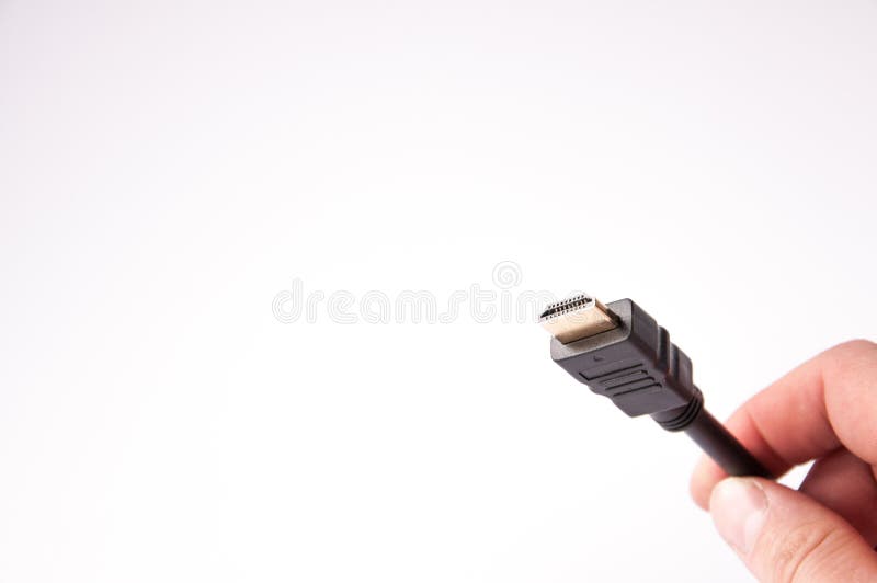 Hdmi кабеля с черной пропиткой соединиться в руке стоковое фото Hdmi кабеля с черной пропиткой соединиться в руке стоковое фото