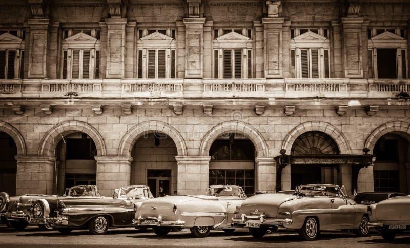 HDR - American convertible vintage cars parked lined up on the side street in Havana Cuba - Ret