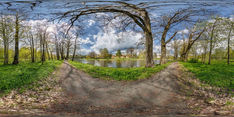 360 hdri panorama view on pedestrian walking path among poplar grove with clumsy branches near lake in full seamless spherical.equirectangular projection with , ready VR AR content.