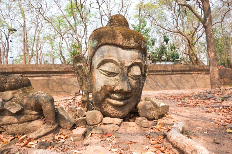 Head of Buddha statue in forest at Wat Umong