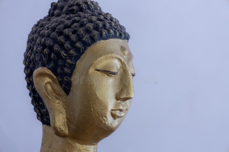 Head of a Buddhist Statue Painted in Gold Color Stock Image - Image of ...