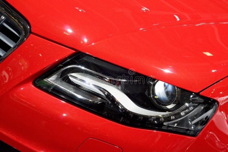 Headlight of Bright Red Shiny Car with Light Reflection and Glare Stock  Image - Image of gear, equipment: 224379411