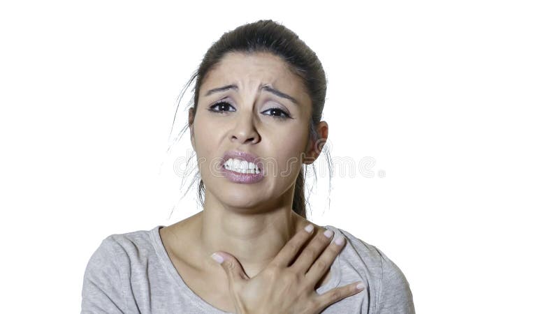 Head portrait of young attractive and beautiful sad latin woman suffering pain and depression feeling stressed and negative isolat