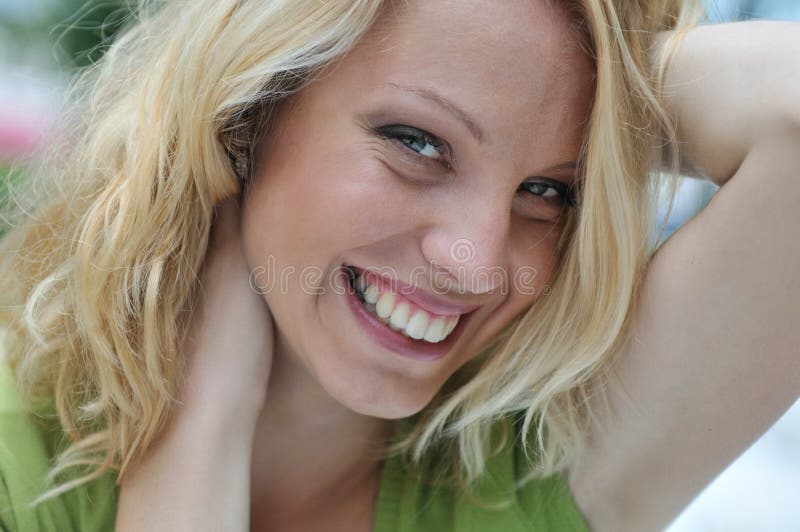 Head portrait of young smiling woman outdoors royalty free stock photo Head portrait of young smiling woman outdoors royalty free stock photo