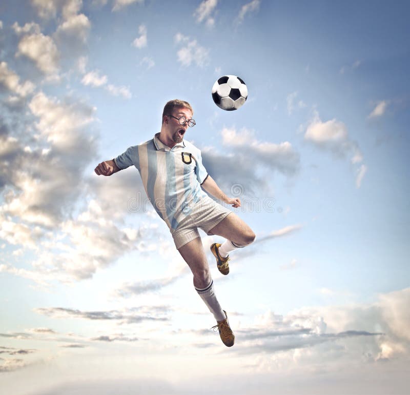 Soccer player heads ball on hi-res stock photography and images