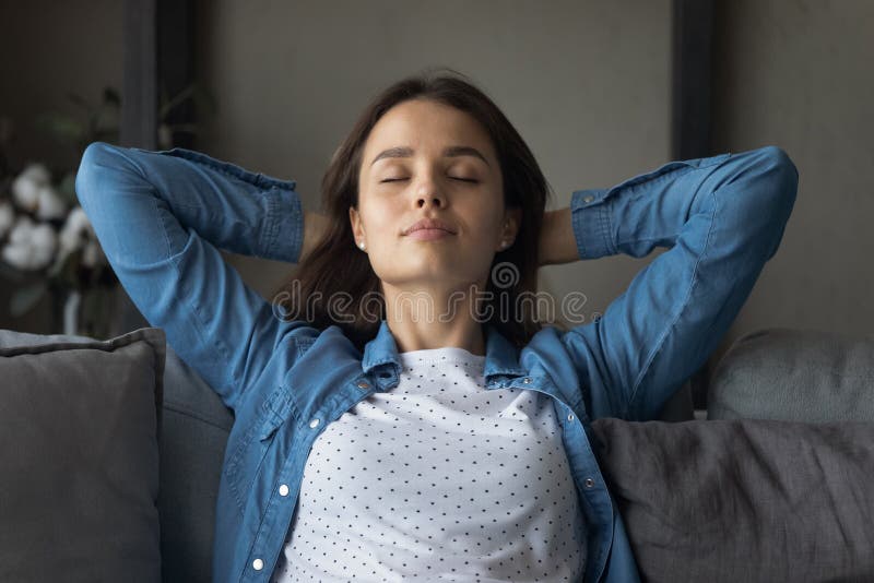 Happy Relaxed Attractive Young Woman Sleeping On Cozy Sofa Stock Image