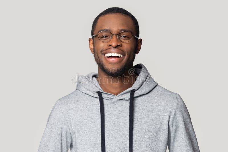 Head shot portrait laughing African American man in glasses