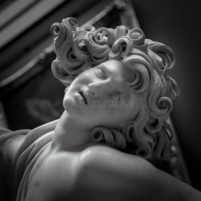 Head and Shoulders Detail of the Ancient Sculpture. Isolated on White