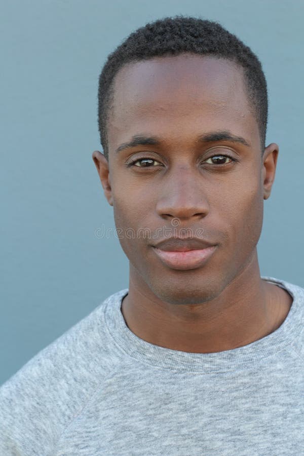 Head and shoulders portrait of a handsome African American man on a blue background royalty free stock images Head and shoulders portrait of a handsome African American man on a blue background royalty free stock images