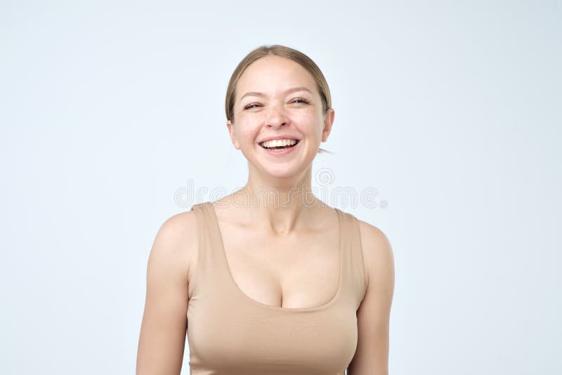Head and shoulders studio portrait of beautiful young caucasian woman, with perfect skin and toothy smile. royalty free stock photo Head and shoulders studio portrait of beautiful young caucasian woman, with perfect skin and toothy smile. royalty free stock photo