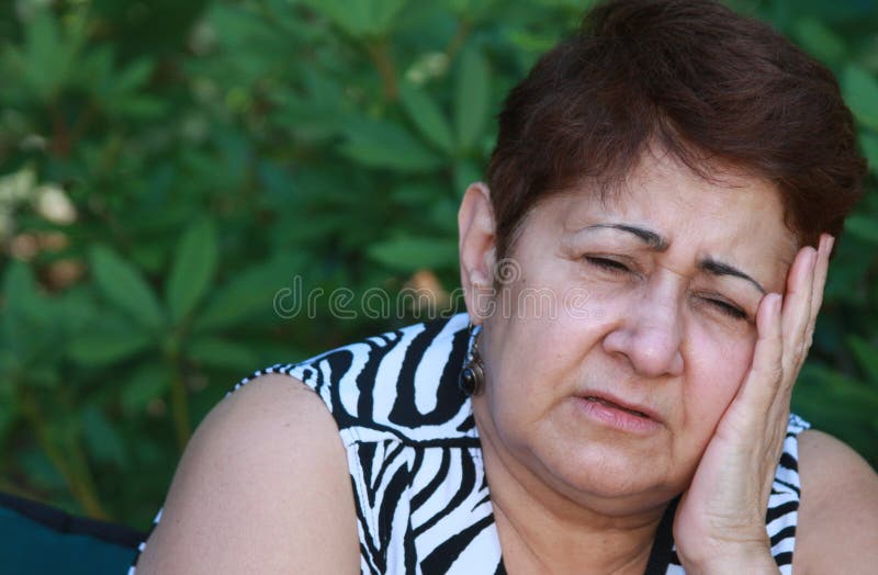 A 60 years-old woman is suffering a terrible headache from stress.