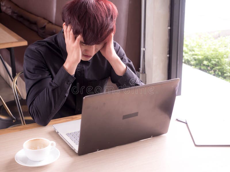 Headache, tired man with laptop and coffee having a work, businessman in office or home royalty free stock images Headache, tired man with laptop and coffee having a work, businessman in office or home royalty free stock images