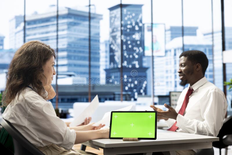 Headhunter doing screening process with chroma key tablet royalty free stock photography