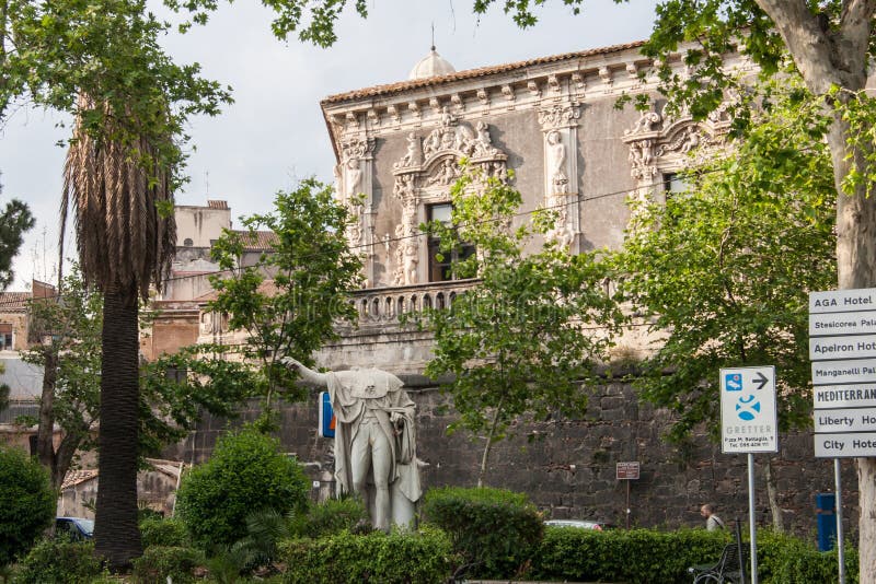 Statue of Ferdinand I in front of Palazzo Biscari, Sicily, Italy. Headless marble statue of King Ferdinand I, who was so hated that his statue was decapitated royalty free stock image Statue of Ferdinand I in front of Palazzo Biscari, Sicily, Italy. Headless marble statue of King Ferdinand I, who was so hated that his statue was decapitated royalty free stock image