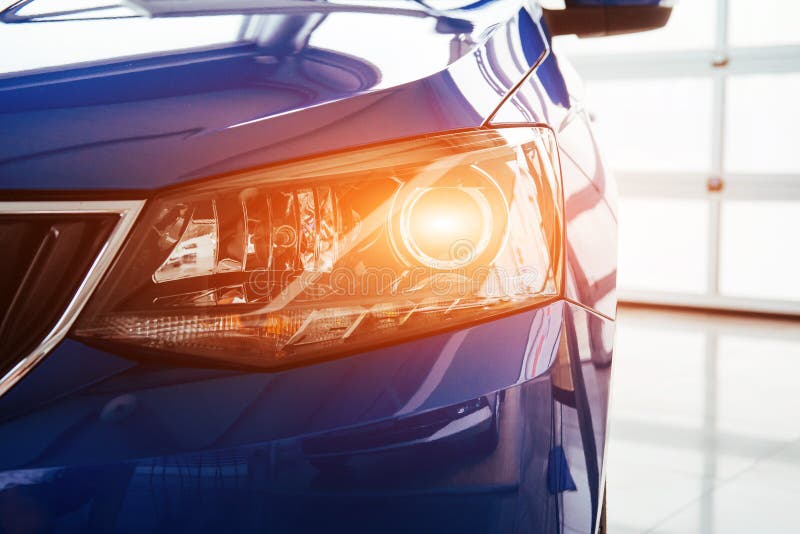 The Headlights and the Hood of a New Luxury Car. Stock Photo Image of