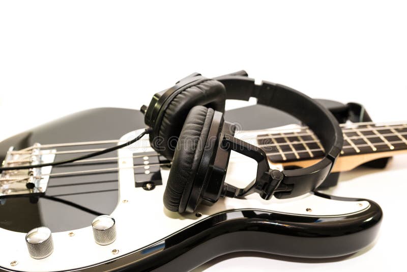 Bass Guitar Neck Isolated on Black Background, Shallow Depth of Field