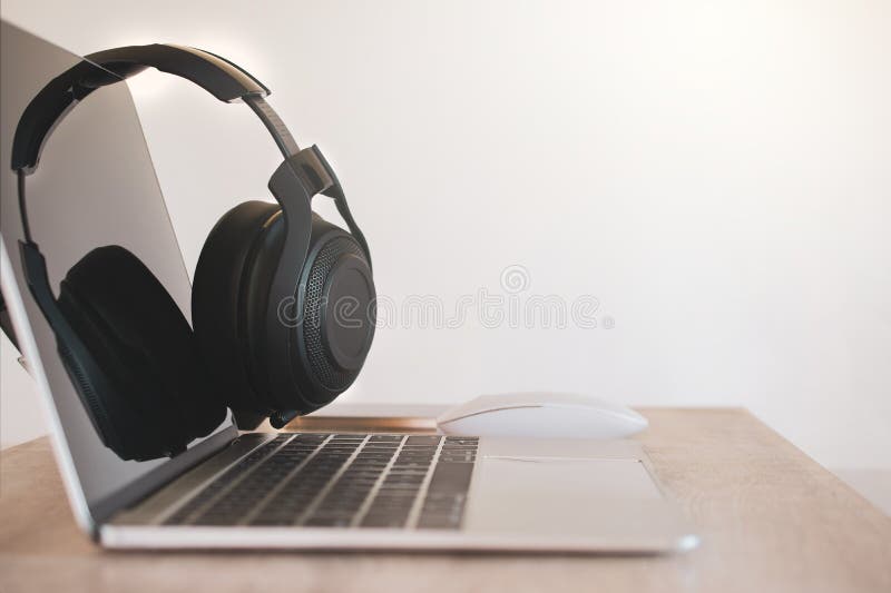 Headphones Black, Smartphone and Laptop on Work Desk. Stock Image
