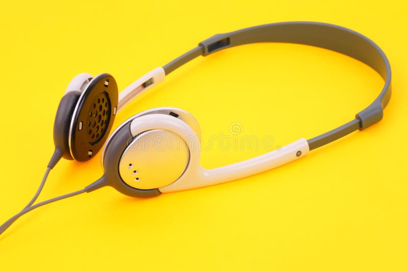 Headphones on yellow stock photo. Image of closeup, color 11596968