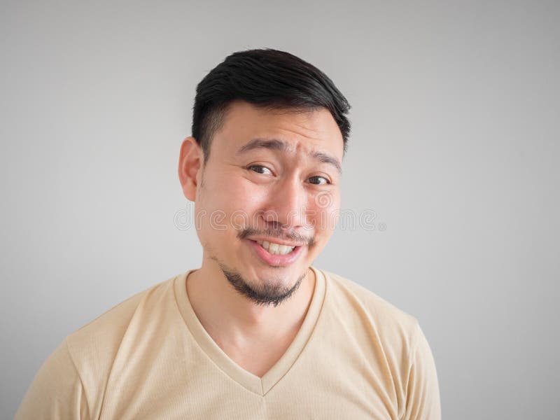 Headshot of funny guilty face of Asian man with beard and mustache. Headshot of funny guilty face of Asian man with beard and mustache.