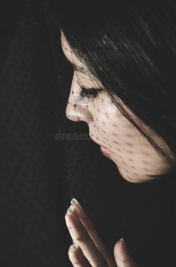 Headshot brunette model experimenting with shadows royalty free stock photo