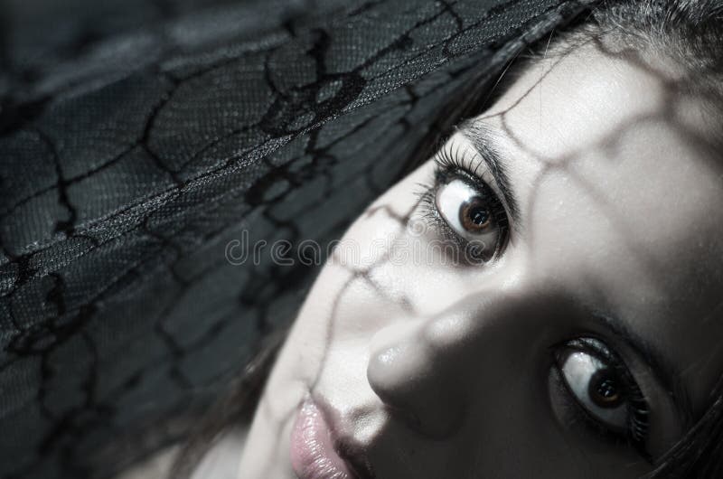 Headshot brunette model using patterned shadows as stock photo