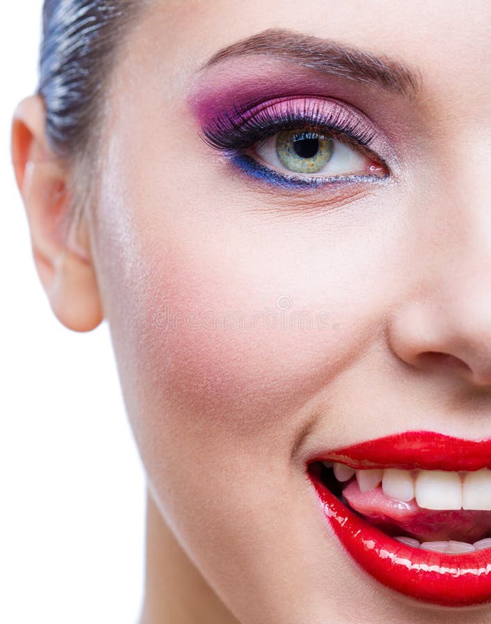 Headshot of female half-face with bright makeup