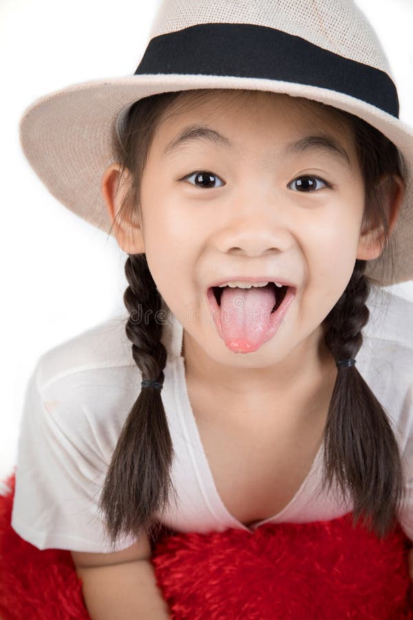 Headshot Portrait of happy cute girl show you tongue.