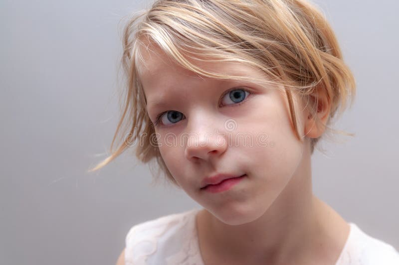 headshot of pretty young girl a little bit serious stock photos