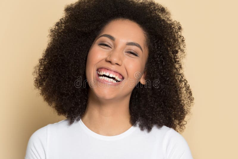 Headshot of smiling african American girl posing in studio stock photography Headshot of smiling african American girl posing in studio stock photography