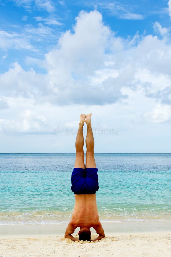 Headstand by the beach