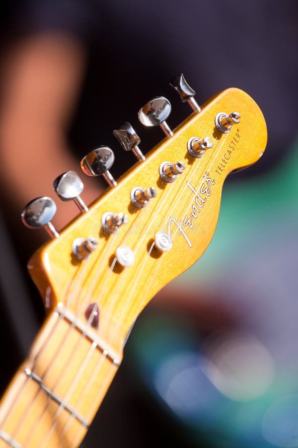 Headstock with frets, neck and fretboard of old classic legendary solo guitar Fender Telecaster at rehearsal