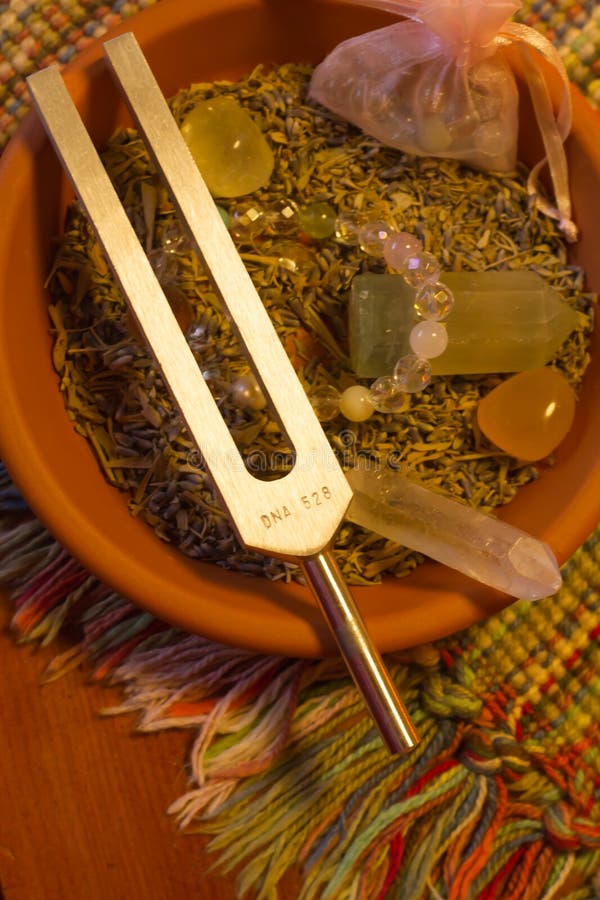 Healing tuning fork and crystal stone on table . stock image Healing tuning fork and crystal stone on table . stock image