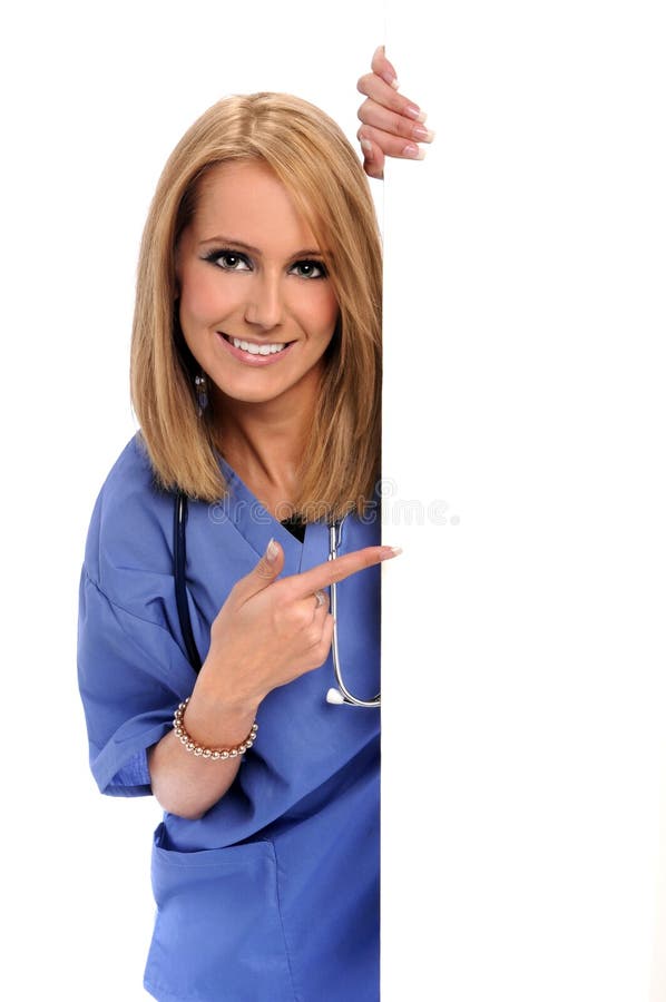Health care worker pointing to blank sign. Health care worker pointing to blank sign