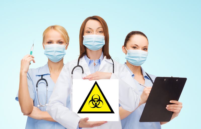 Female doctor and nurses with biohazard sign stock photography Female doctor and nurses with biohazard sign stock photography