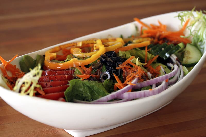 Healthy salad display in white bowl. Healthy salad display in white bowl.