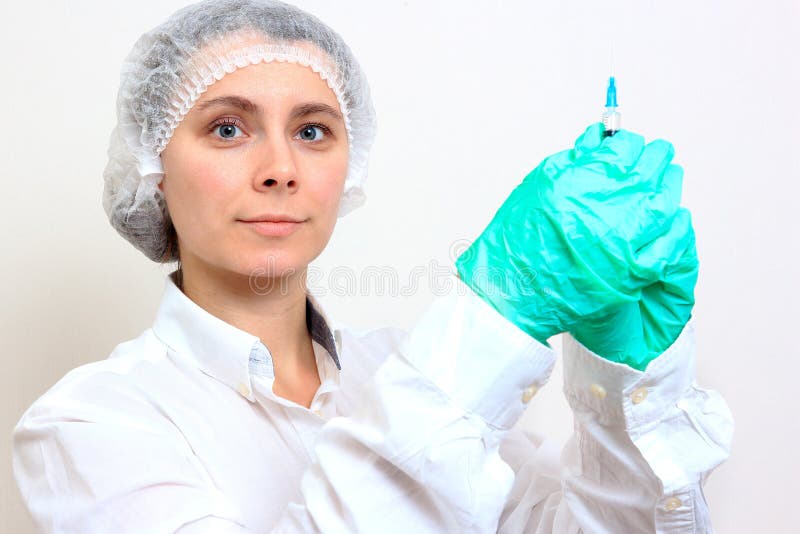 Health worker holds syringe royalty free stock image