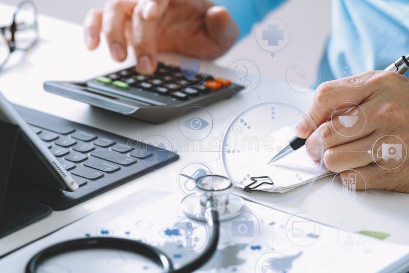 Healthcare costs and fees concept.Hand of smart doctor used a calculator for medical costs in modern hospital with VR icon diagram