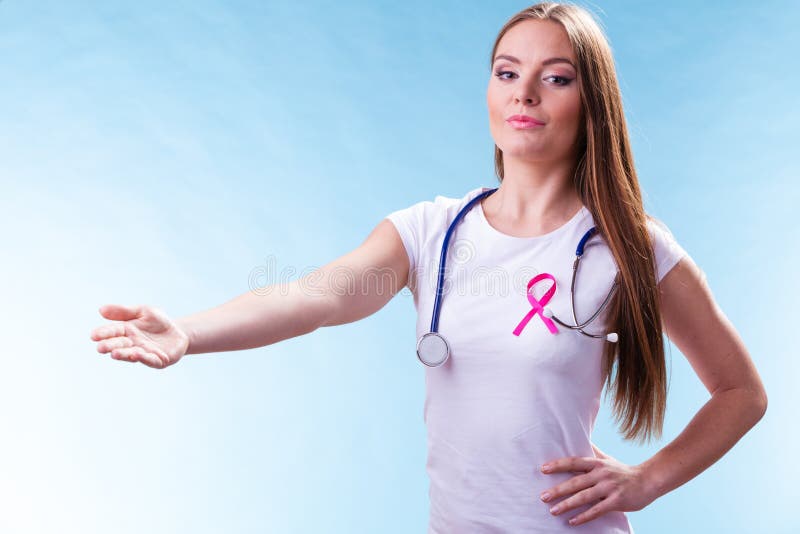 Woman pink ribbon on chest making welcome gesture royalty free stock image Woman pink ribbon on chest making welcome gesture royalty free stock image