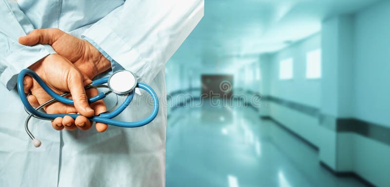 Healthcare And Medicine concept. Doctor. Unrecognizable Male Doctor Hands With Stethoscope Behind His Back, Closeup