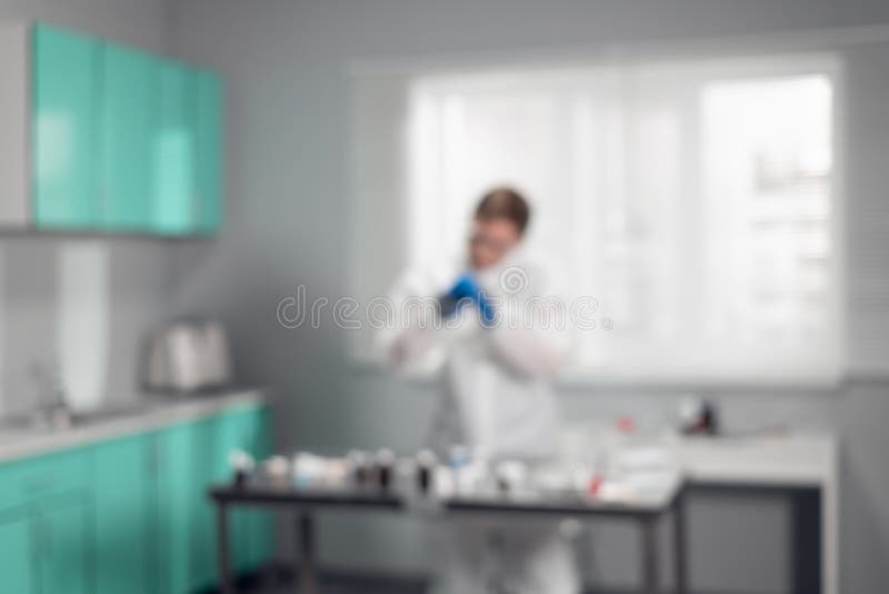 Healthcare pharmacy concept. Blurred background. Young scientist working in a chemistry laboratory royalty free stock photography