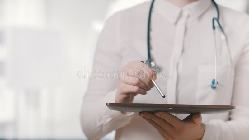 Healthcare and technology. Doctor working on digital tablet in hospital. Healthcare and technology. Doctor working on a digital tablet in hospital. Healthcare royalty free stock image Healthcare and technology. Doctor working on digital tablet in hospital. Healthcare and technology. Doctor working on a digital tablet in hospital. Healthcare royalty free stock image